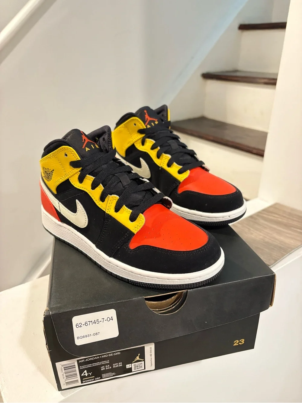 Jordan Air Jordan 1 Mid SE Black/Orange/White Youth Sneaker